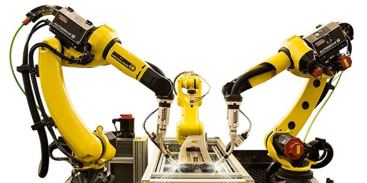 An image of FANUC robots being used in welding applications.